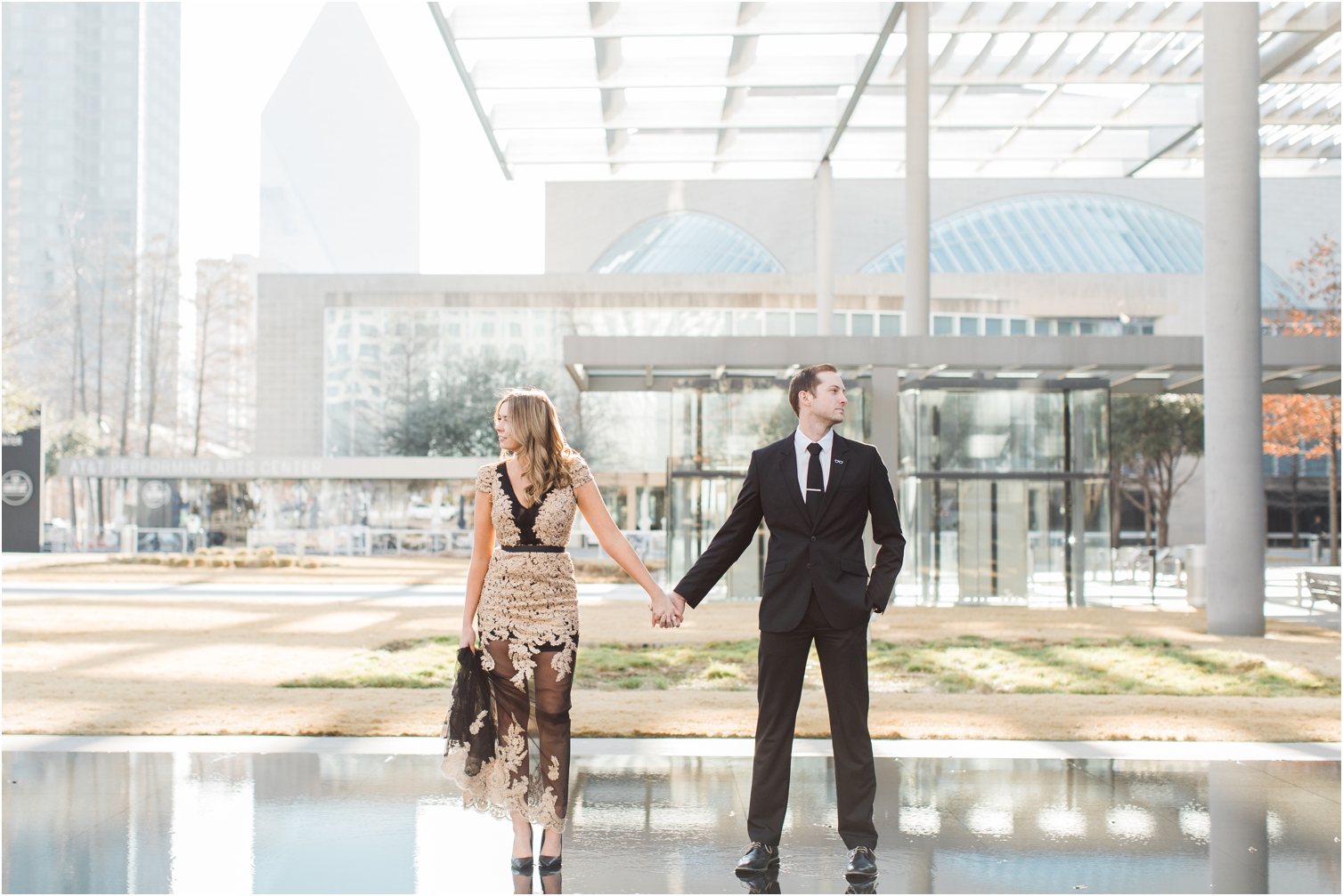 couple holding hands at winspear opera house