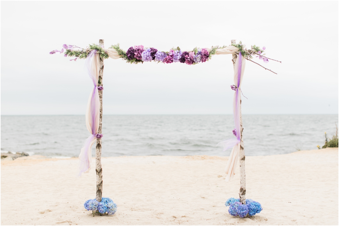 beachside wedding ceremony arch by gaby caskey photography