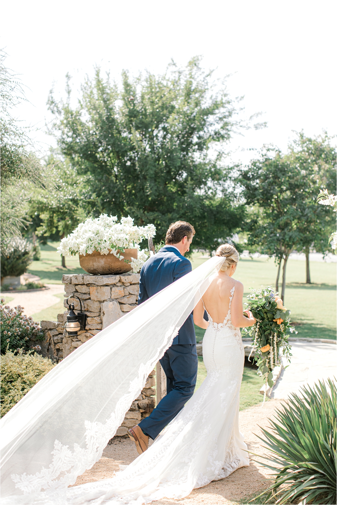 bride and groom walking away from their Ceremony at Brooks at Weatherford